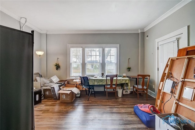 sitting room with dark wood-type flooring and ornamental molding