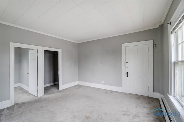 unfurnished bedroom with light colored carpet, crown molding, and a baseboard radiator