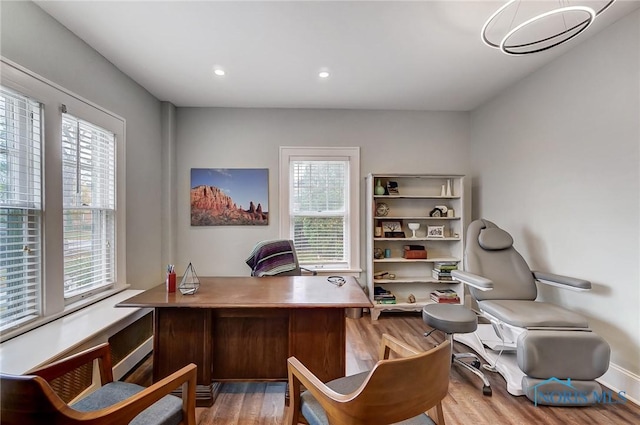 home office featuring light wood-type flooring and a wealth of natural light