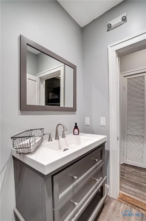 bathroom featuring vanity and wood-type flooring