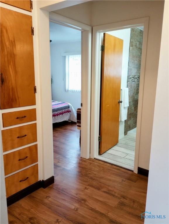 corridor featuring hardwood / wood-style flooring