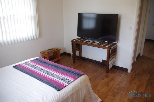 bedroom featuring wood-type flooring