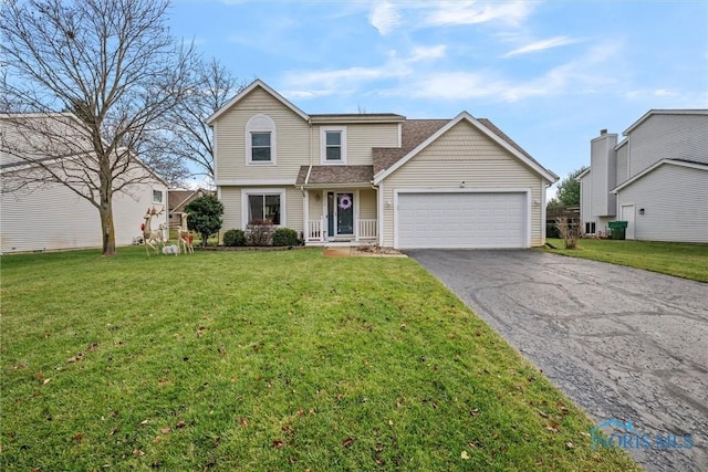 front facade featuring a front yard and a garage