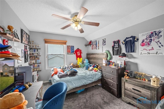 carpeted bedroom featuring a textured ceiling, ceiling fan, and vaulted ceiling