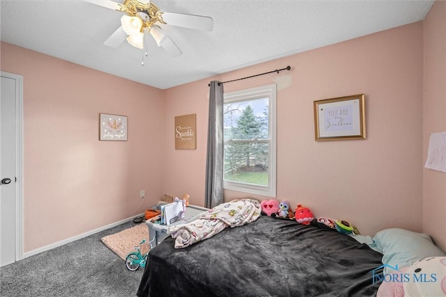 bedroom featuring ceiling fan and carpet floors