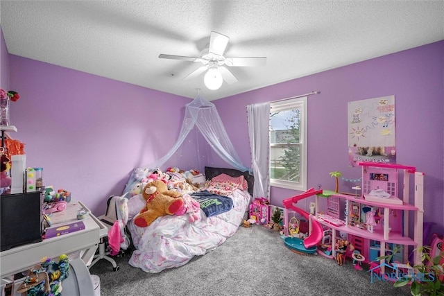 carpeted bedroom with a textured ceiling and ceiling fan