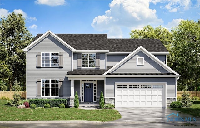 view of front of property featuring a front yard and a garage