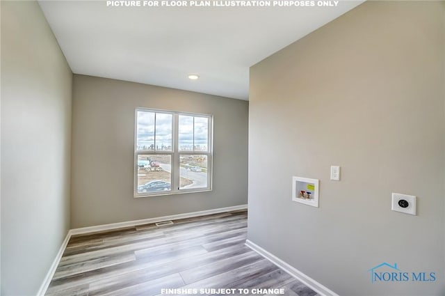 laundry room featuring washer hookup, electric dryer hookup, and light hardwood / wood-style flooring