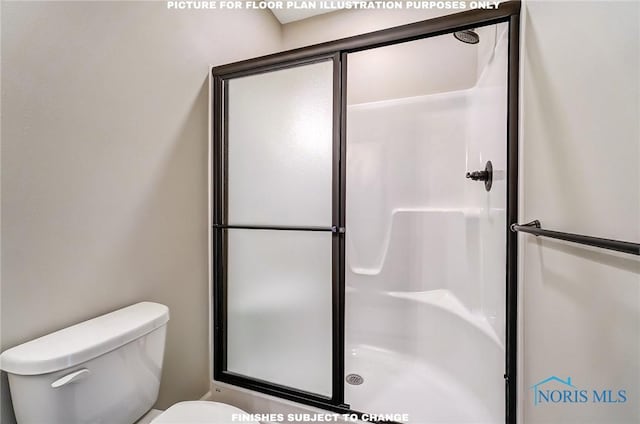 bathroom with a shower with door and toilet