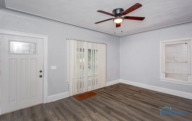 entryway featuring ceiling fan and dark hardwood / wood-style flooring