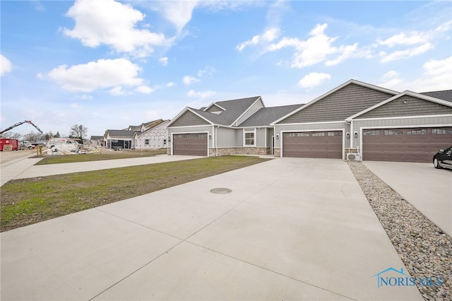 view of front of house featuring a front yard and a garage