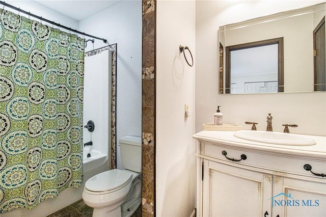 full bathroom featuring shower / bath combo, toilet, and vanity