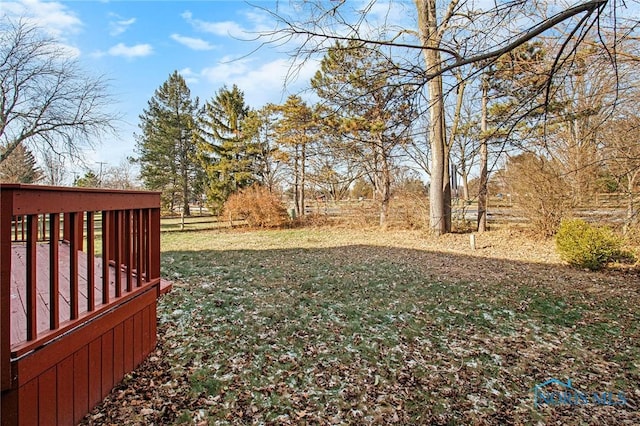 view of yard featuring a wooden deck