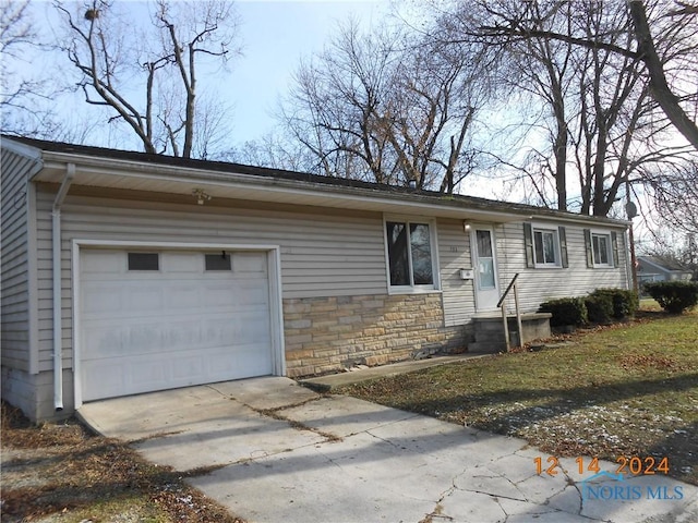 single story home featuring a garage