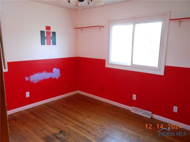 spare room featuring hardwood / wood-style floors