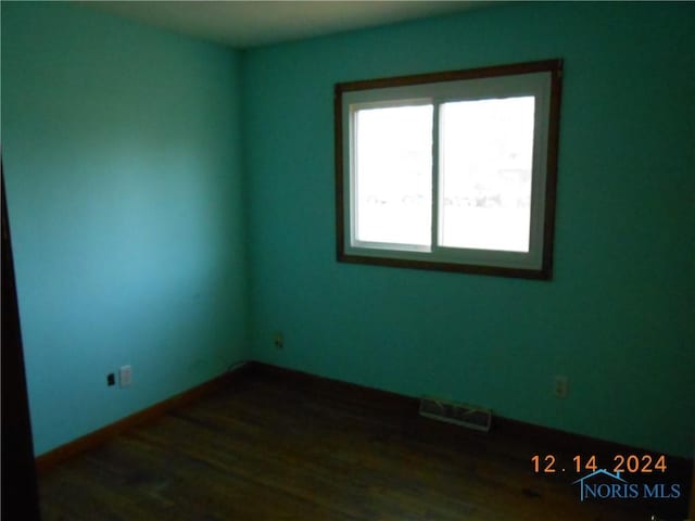 empty room featuring dark hardwood / wood-style floors