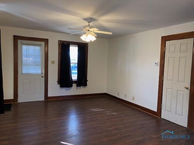 entryway with ceiling fan and dark wood-type flooring