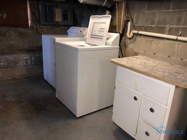 laundry room featuring separate washer and dryer and electric panel