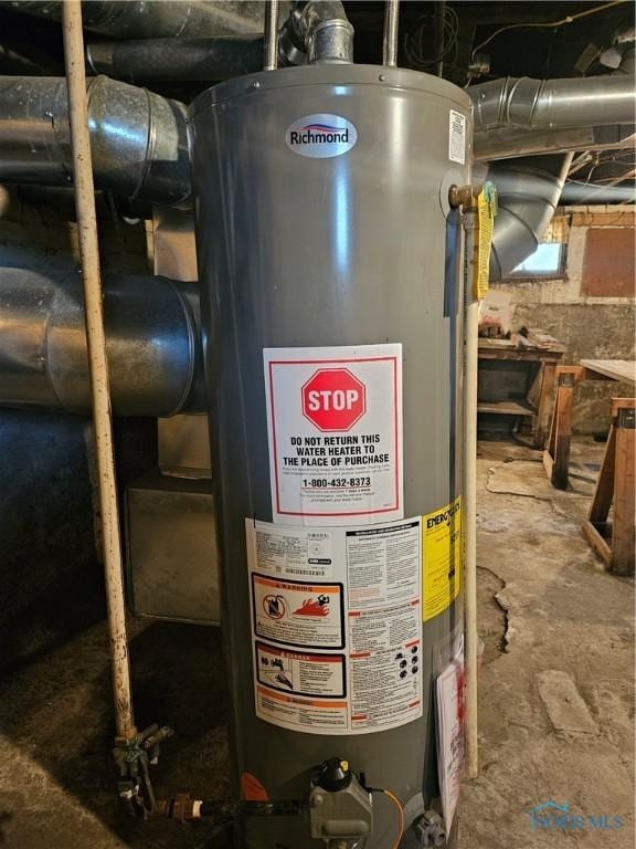 utility room featuring water heater