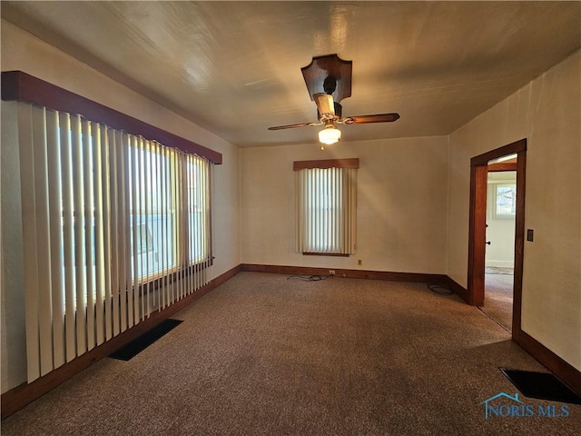 spare room featuring carpet flooring and ceiling fan