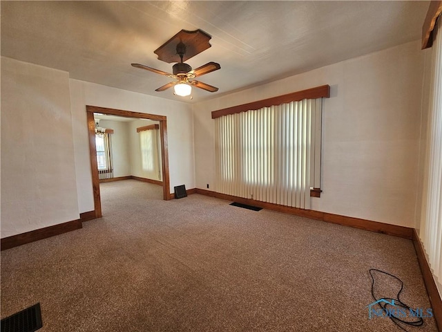 spare room with carpet and ceiling fan