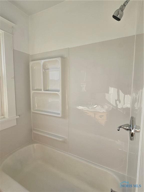 bathroom with shower / bath combination