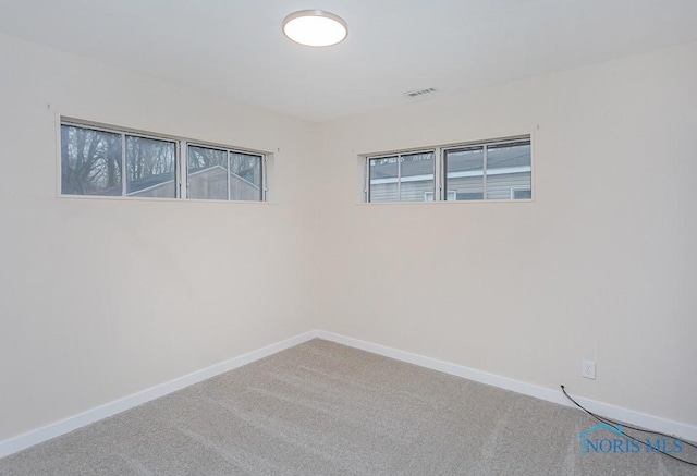 unfurnished room with carpet