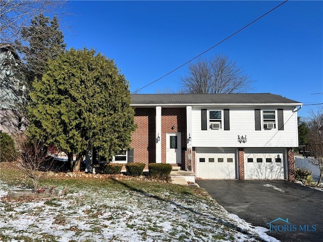 split foyer home featuring a garage