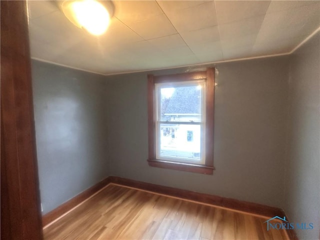 empty room with hardwood / wood-style flooring