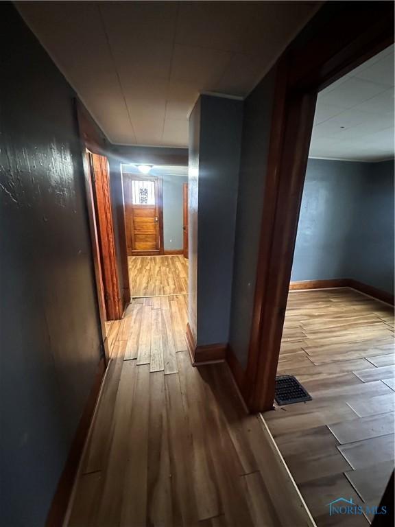 hall with light wood-type flooring