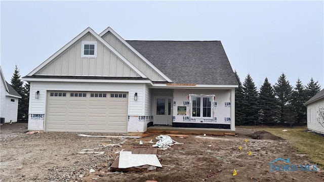 view of front facade with a garage and a porch