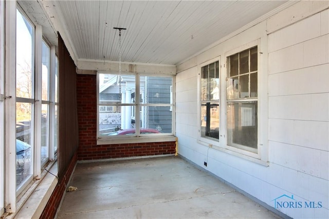 unfurnished sunroom featuring plenty of natural light