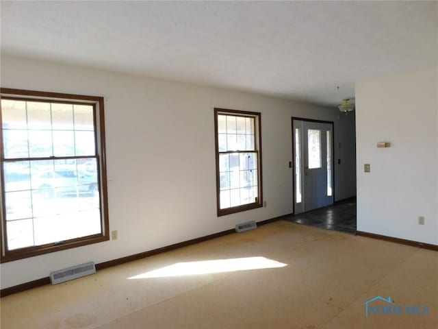 empty room with a chandelier