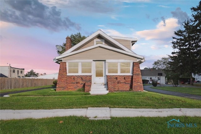 view of front of house with a yard