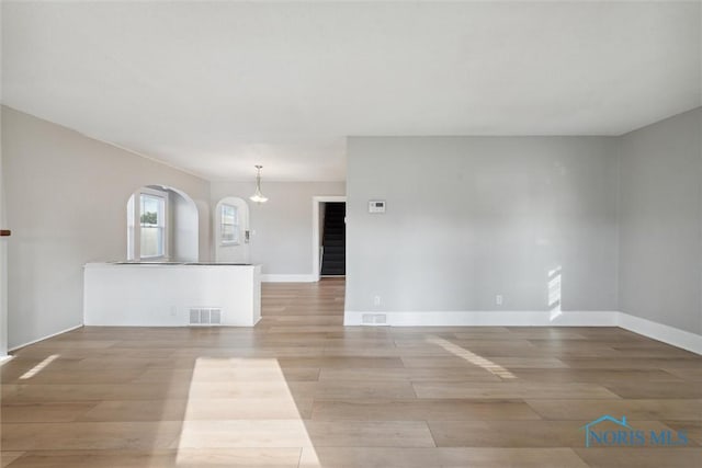 empty room with light hardwood / wood-style floors