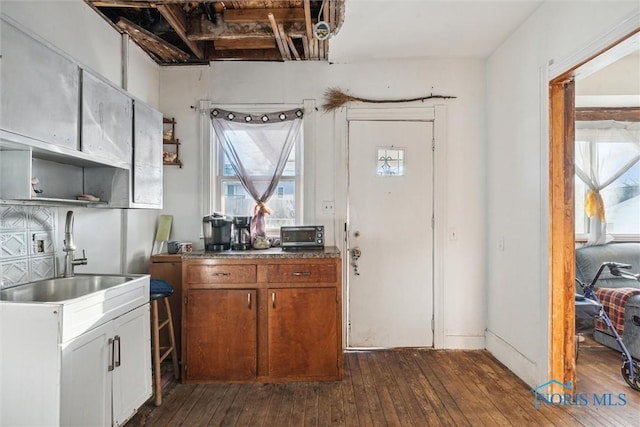 kitchen with dark wood-type flooring and sink