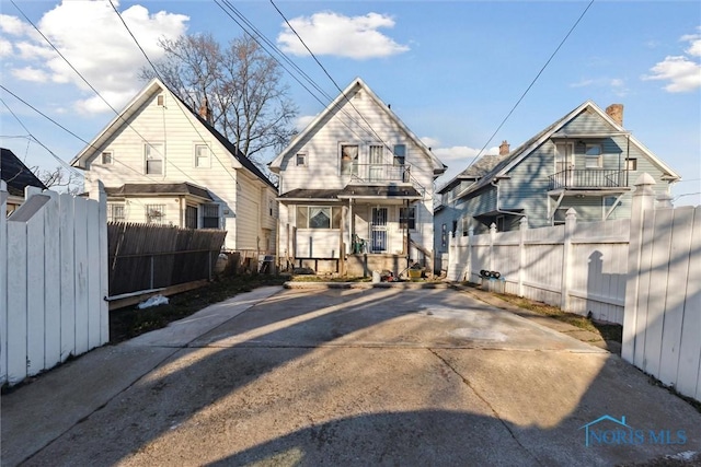 rear view of house with a balcony