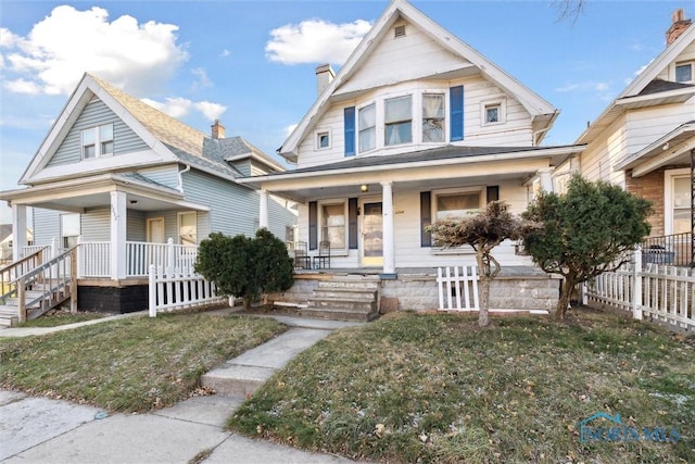 bungalow-style home featuring a porch and a front lawn