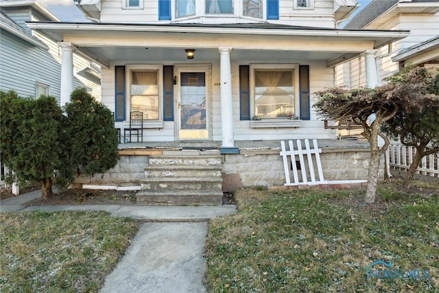 property entrance featuring covered porch