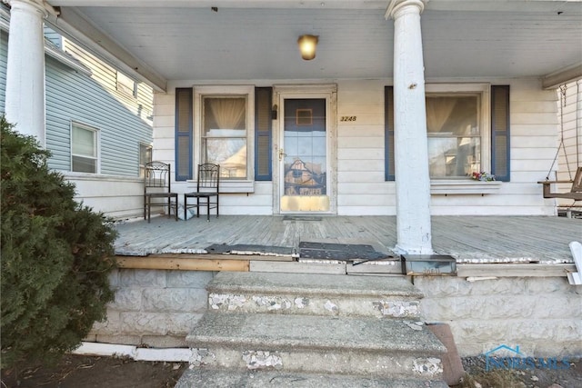 property entrance featuring covered porch