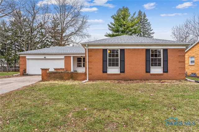 single story home featuring a garage and a front yard