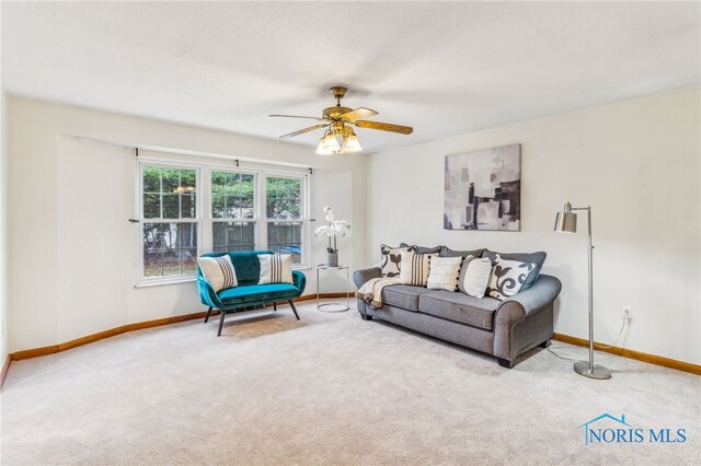 living room with carpet flooring and ceiling fan