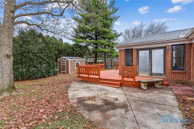 view of yard with a patio area, a shed, and a deck