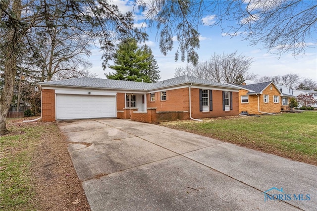 ranch-style home with a garage and a front lawn