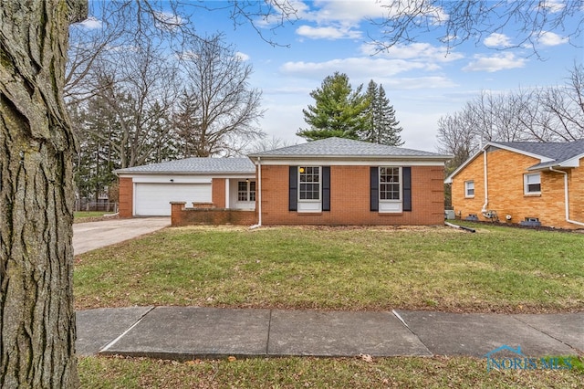 single story home with a garage and a front lawn