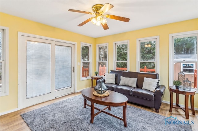 sunroom / solarium with ceiling fan