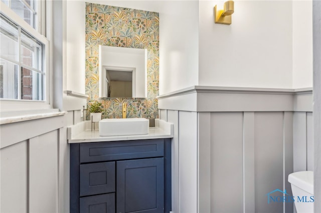 bathroom featuring vanity and toilet