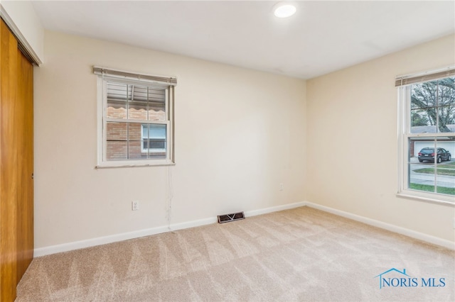 view of carpeted spare room