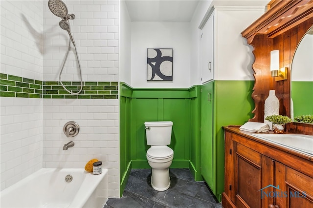 full bathroom featuring vanity, toilet, and tiled shower / bath