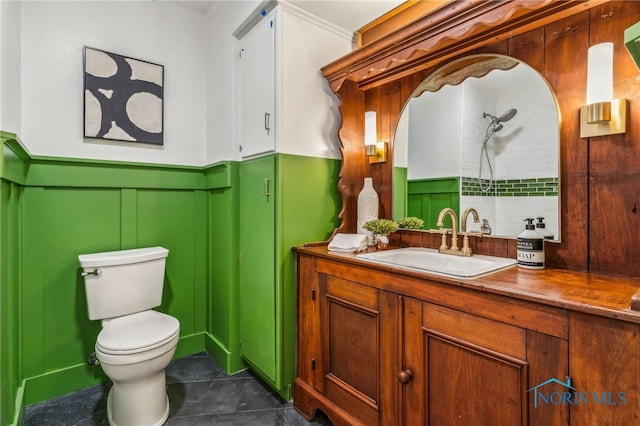 bathroom featuring tile patterned flooring, vanity, and toilet